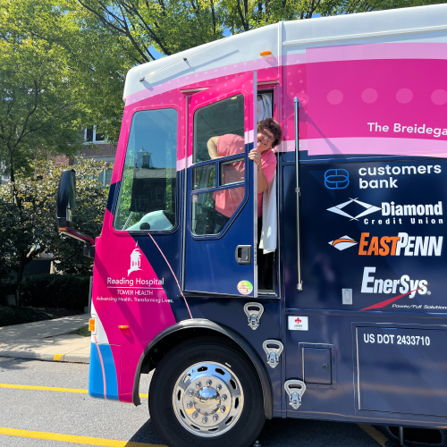 Cecilia Carpenter, Reading Hospital Mobile Mammoggraphy Coach driver smiles from inside the coach.