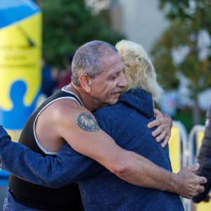 Runners embracing after the 2023 Reading Hospital Road Run in West Reading, PA