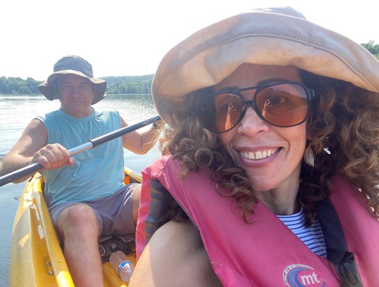 Pamela Hernandez and husband kayaking on lake