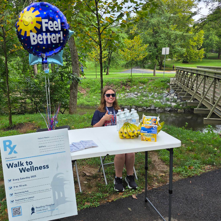 Reading Hospital Walks to Wellness - a volunteer greets participants on the trail 