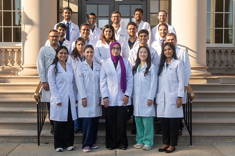 Group of Reading Hospital Neurology residents and faculty posing on the steps of the hospital entrance