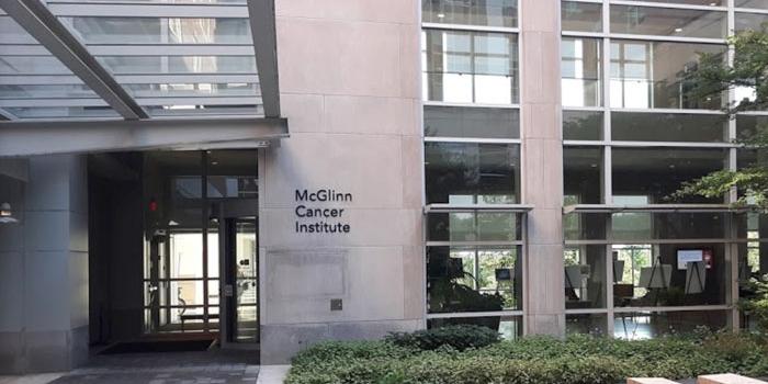 Exterior of building with windows and sign for McGlinn Cancer Institute