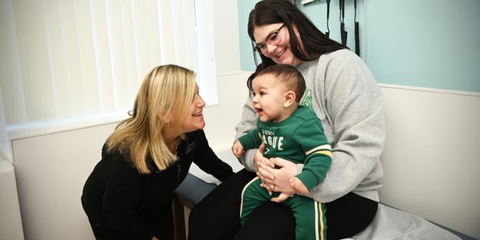 A toddler patient and their parent interact with a doctor at St. Christopher's Pediatric Associates - Roosevelt Blvd