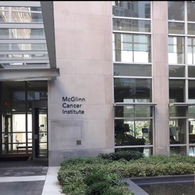 Exterior of building with windows and sign for McGlinn Cancer Institute