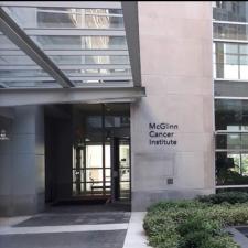 Exterior of building with windows and sign for McGlinn Cancer Institute